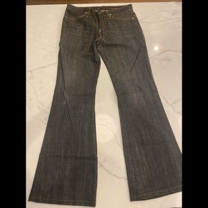 AG black/distressed on trend flare jeans.